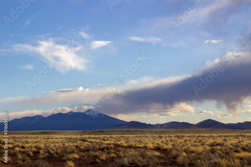 clouds over mountains and desert in Wupatki National Monument, Arizona 