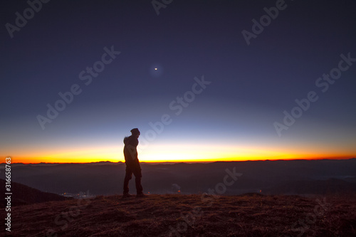 silhouette of man at sunset