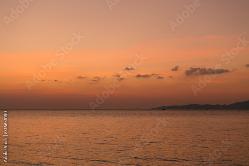 Sea pink sunset. Beautiful color clouds.