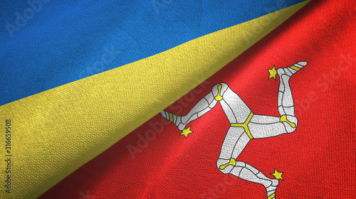 Foto Ukraine and Isle of Mann two flags textile cloth, fabric texture