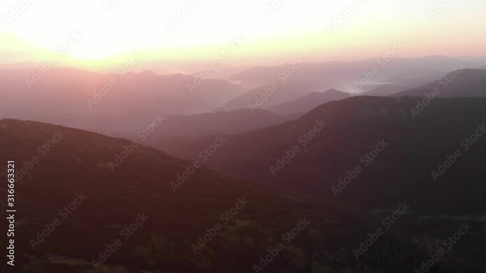 Fairytale sunset over mountain peaks in summer. Carpathian mountains at sunset. Amazing nature background. Fairytale sunset over mountain peaks in summer. Carpathian mountains at sunset. Amazing nature background.