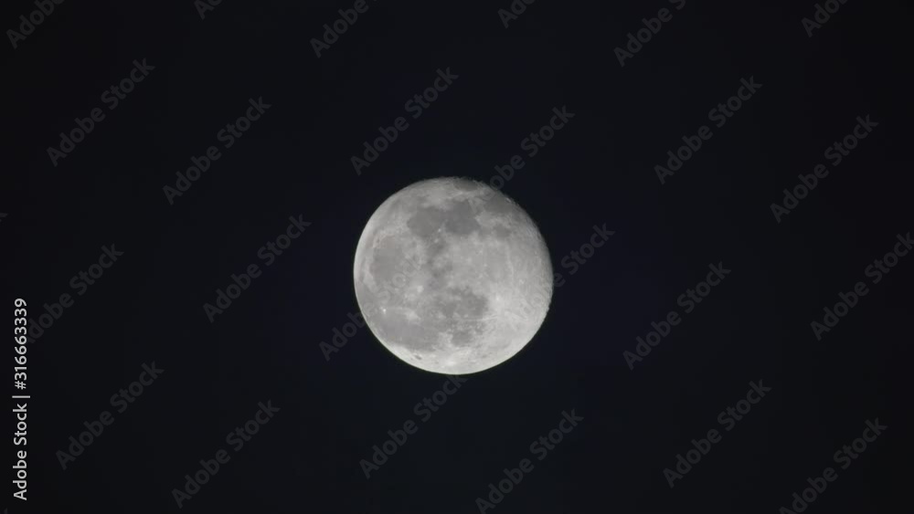 A cloudy night with nearly full moon view from a refractor telescope at near Zenith, Locked shot A cloudy night with nearly full moon view from a refractor telescope at near Zenith, Locked shot