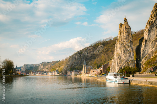 Meuse river with Bayard rock, Dinant, Belgium photo