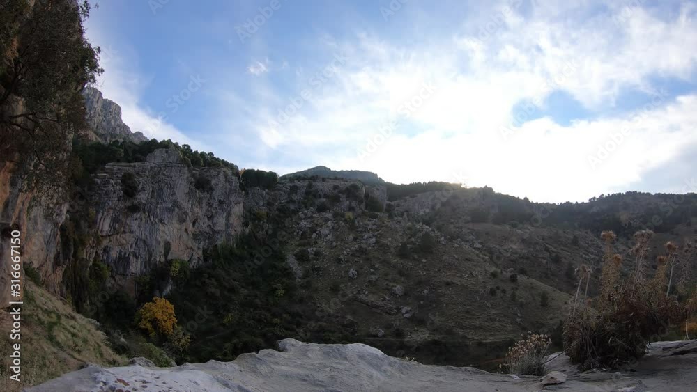Time Lapse - Beautiful sun illuminating the clouds in a blue sky. Rocky cliffs in Cazorla, Spain. Time Lapse - Beautiful sun illuminating the clouds in a blue sky. Rocky cliffs in Cazorla, Spain.