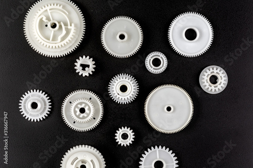 Machine parts and other spare parts, gears, gears, keys, springs. photo