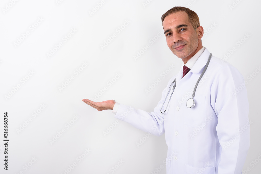 Portrait of mature handsome Persian man doctor Portrait of mature handsome Persian man doctor