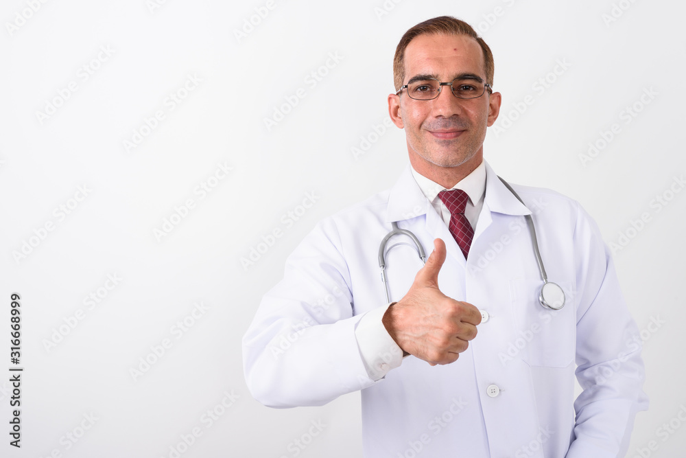 Portrait of mature handsome Persian man doctor Portrait of mature handsome Persian man doctor