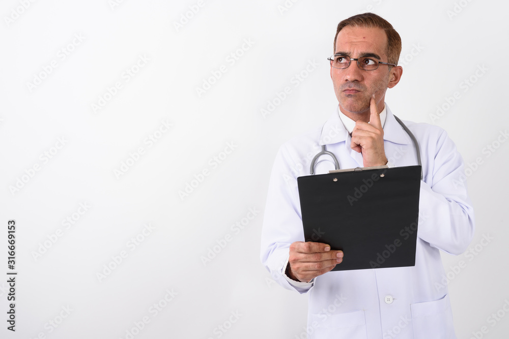 Portrait of mature handsome Persian man doctor Portrait of mature handsome Persian man doctor