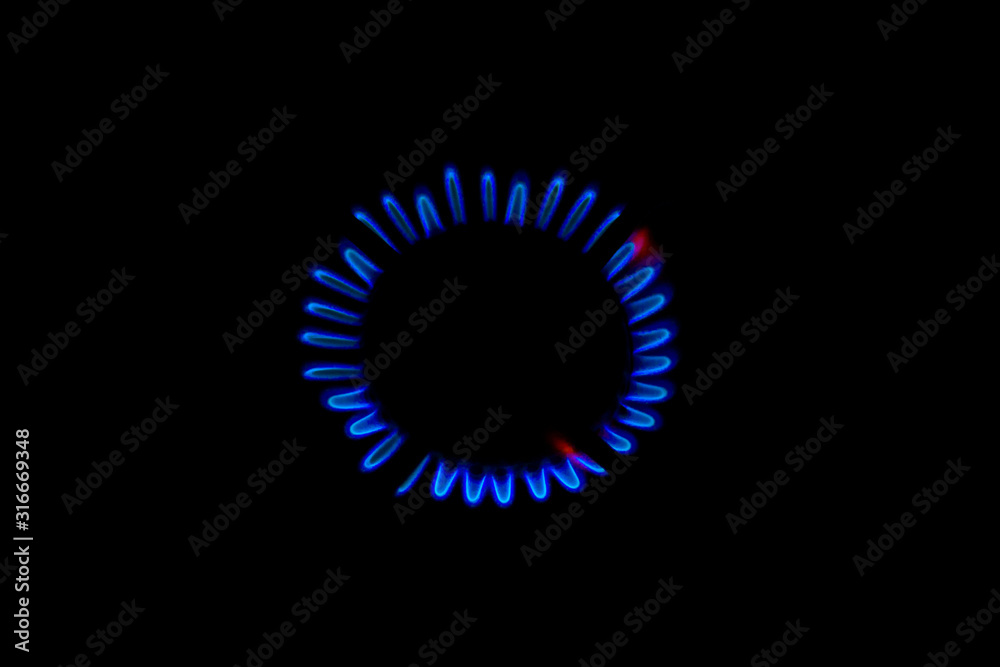 blue flame of a burning burner in the dark background blue flame of a burning burner in the dark background