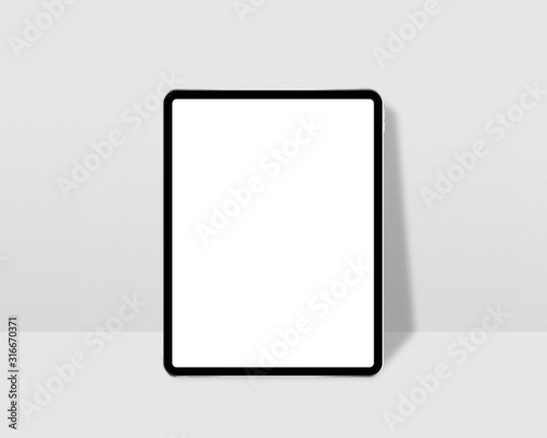 Modern tablet with blank white screen. Tablet mockup on minimal background. Modern tablet display mockup scene. Mockup scene. Photo mockup with clipping path.