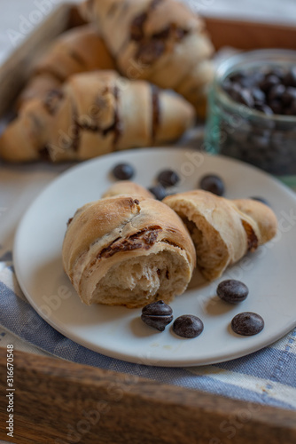 home made croissant filled with chocolate on a plate