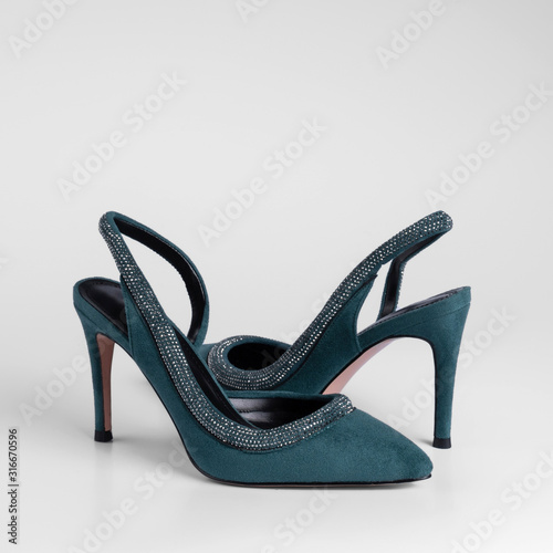 womens green suede holiday mid-heel shoes with decorative rhinestones and heel strap on a white studio background