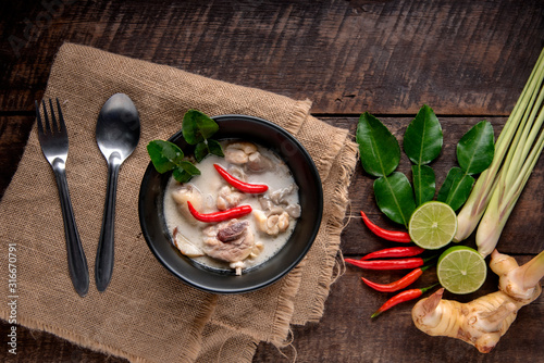 Chicken Coconut Soup (Tom Kha Gai),Coconut milk soup with chicken and Thai ingredients on the table, top view, Thai food that is popular in Thailand.