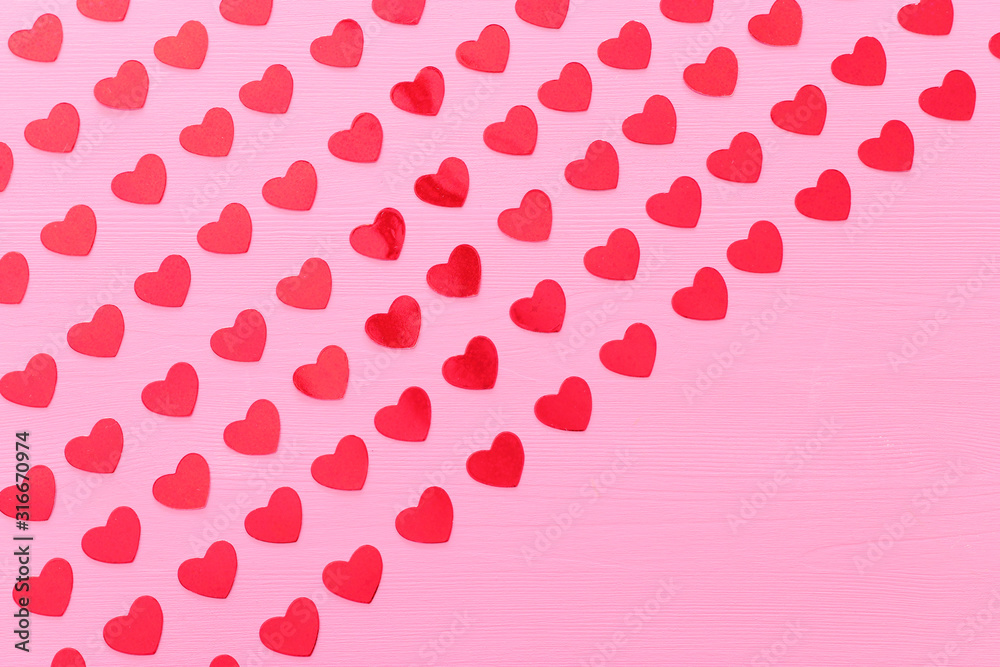 Valentines day concept. red hearts over wooden pink background. Flat lay composition Valentines day concept. red hearts over wooden pink background. Flat lay composition