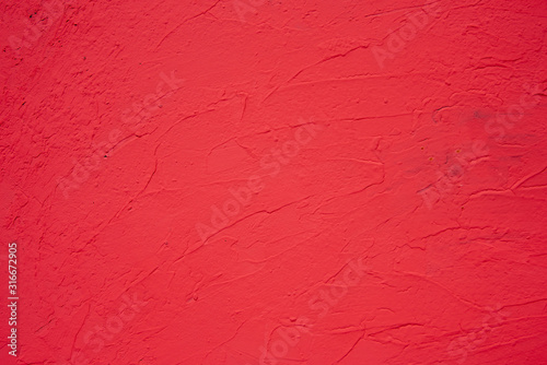 The red background of the wall,Textured background and red lighting
