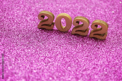 Happy New year 2022 with space copy on purple glitter background