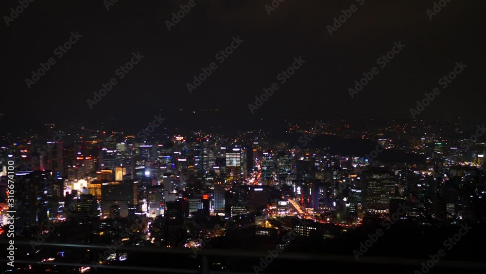 Seoul City At Night Time Lapse. Aerial View And Buildings With Downtown Skyline