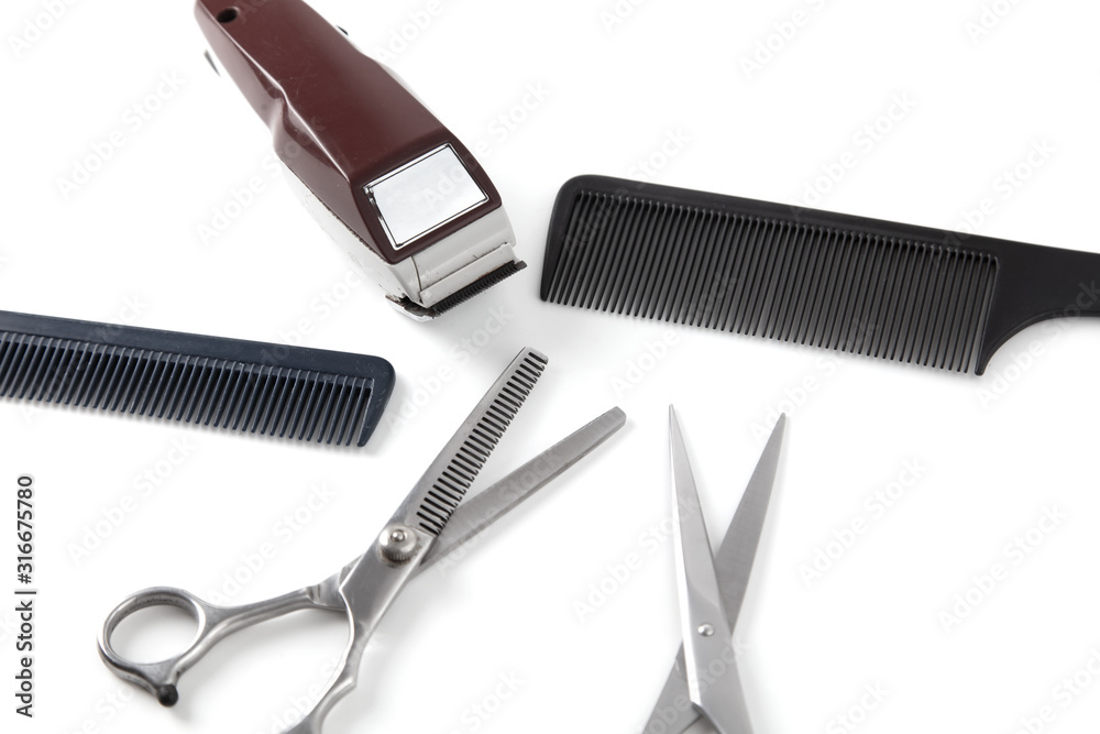 Obraz premium Hair clipper and comb and scissors