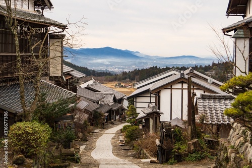 石畳の坂道から見下ろす古い町並みの風景／Magome-juku is an old town in Gifu Prefecture, Japan. © yumiko