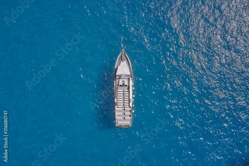 White liner on blue water, aerial view. Cinque Terre National Park, Italy
