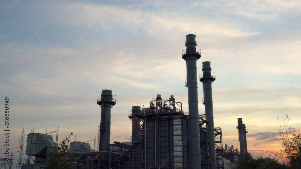 Gas turbine electrical power plant in industrial Estate. Power plant at sunset. Gas turbine electrical power plant in industrial Estate. Power plant at sunset.