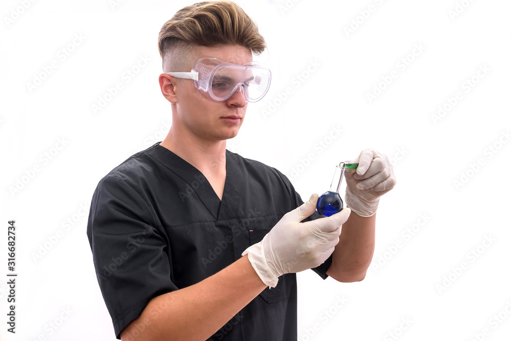 Chemist in laboratory with test tube examining it isolated on white background Chemist in laboratory with test tube examining it isolated on white background