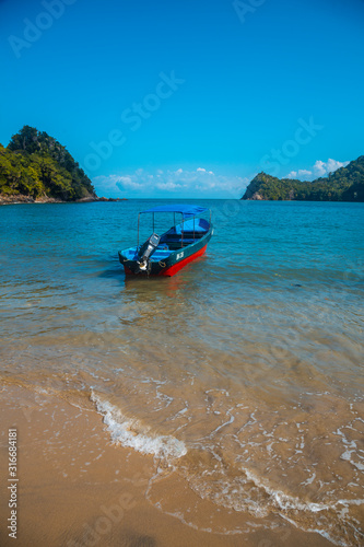 A boat on the beach of Puerto Caribe in Punta de Sal in the Caribbean Sea, Tela. Honduras