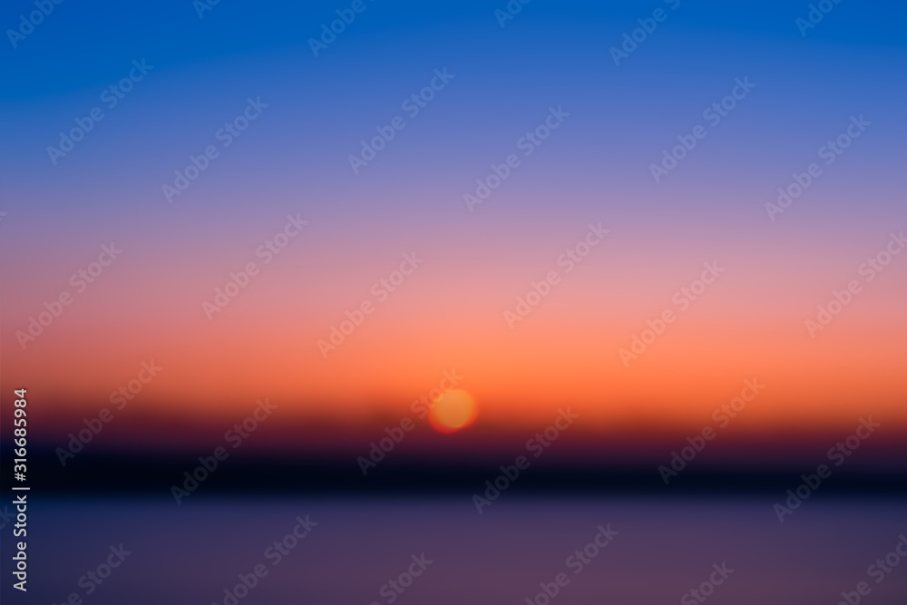 Blur image of the sun rising in the morning.