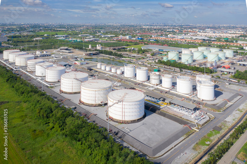 Aerial view of Chemical industry storage tank and tanker truck In wailting in Industrial Plant to tranfer oil to gas station. photo