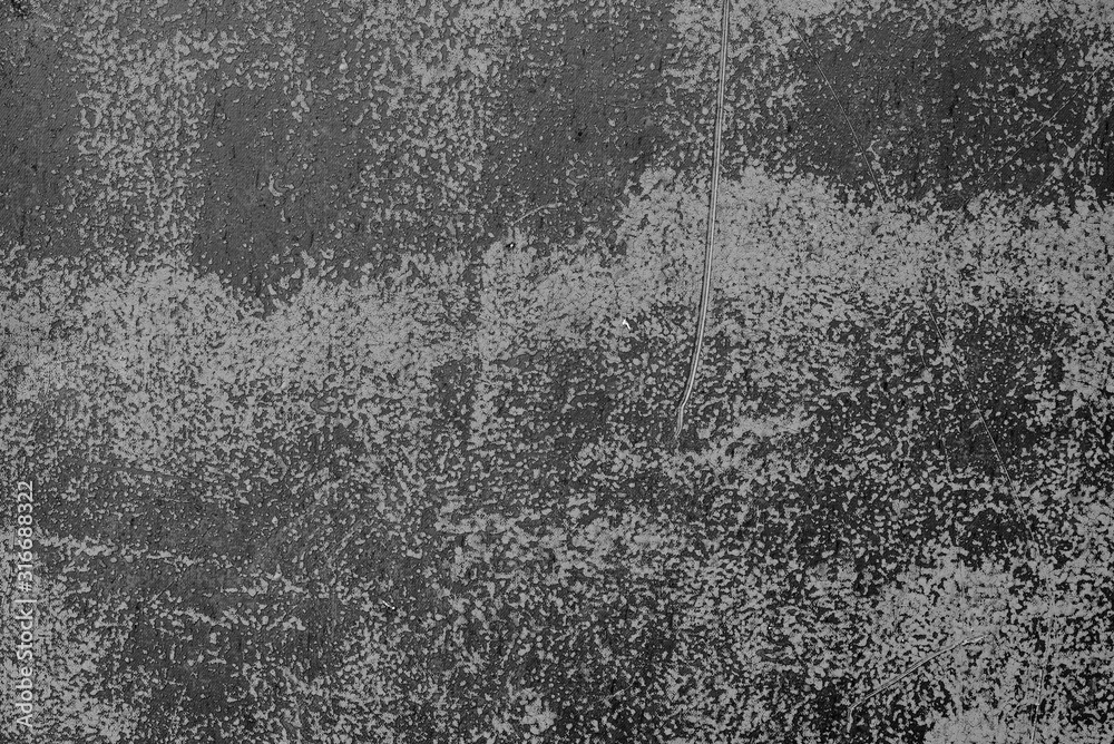 Texture of a metal wall with cracks and scratches which can be used as a background Texture of a metal wall with cracks and scratches which can be used as a background
