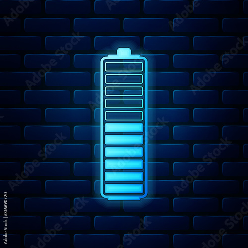 Glowing neon Battery charge level indicator icon isolated on brick wall background. Battery charging - power sign. Electricity symbol - energy sign. Vector Illustration