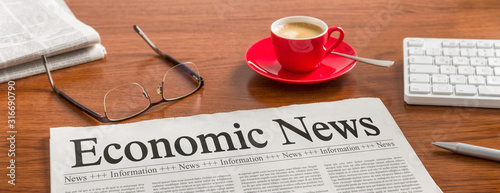 A newspaper on a wooden desk - Economic News