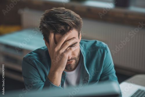 Fotografi Portrait of a tired sad young man