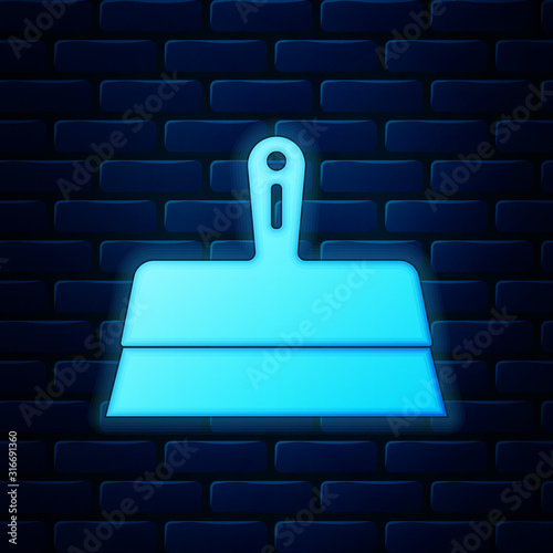 Glowing neon Putty knife icon isolated on brick wall background. Spatula repair tool. Spackling or paint instruments. Vector Illustration