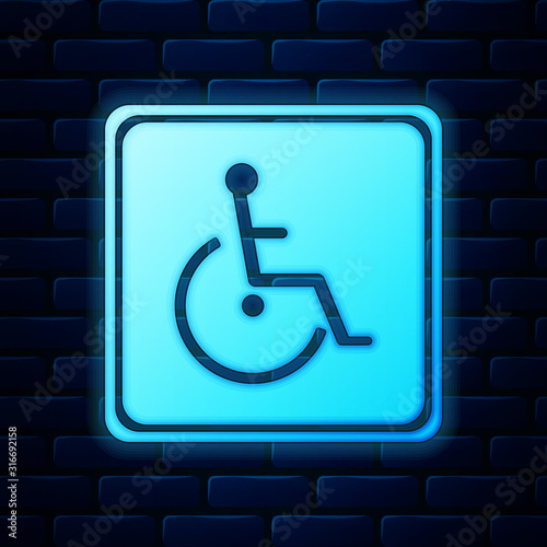 Glowing neon Disabled handicap icon isolated on brick wall background. Wheelchair handicap sign. Vector Illustration