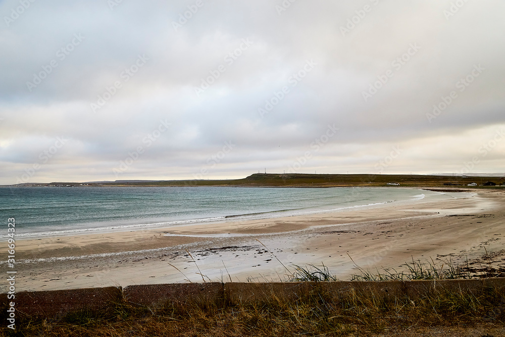 Norway landscape with beach of the Northern sea in cloudy weather Norway landscape with beach of the Northern sea in cloudy weather