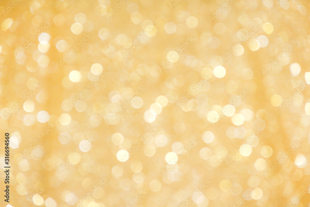 Gold yellow sparkle bokeh glitter abstract on christmas light background