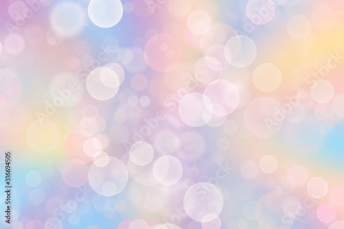 Abstract blurred soft focus bokeh of bright on pastel background.
