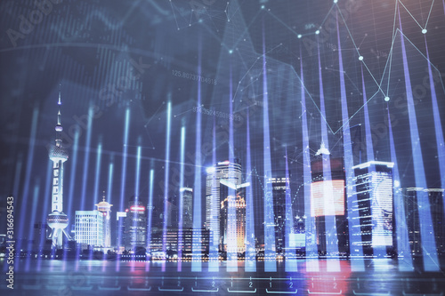 Financial graph on night city scape with tall buildings background double exposure. Analysis concept.