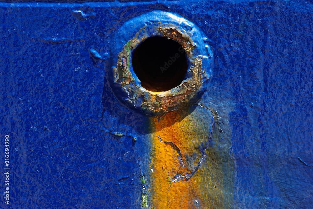 Scupper hole for water drainage water from main deck of the cargo ship ...