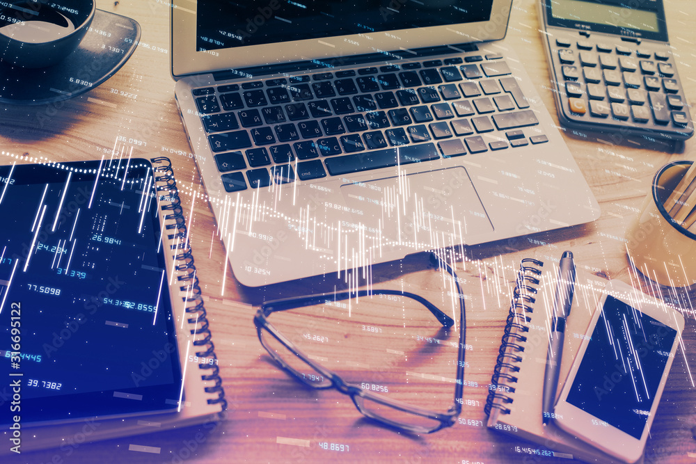 Double exposure of chart and financial info and work space with computer background. Concept of international online trading. Double exposure of chart and financial info and work space with computer background. Concept of international online trading.