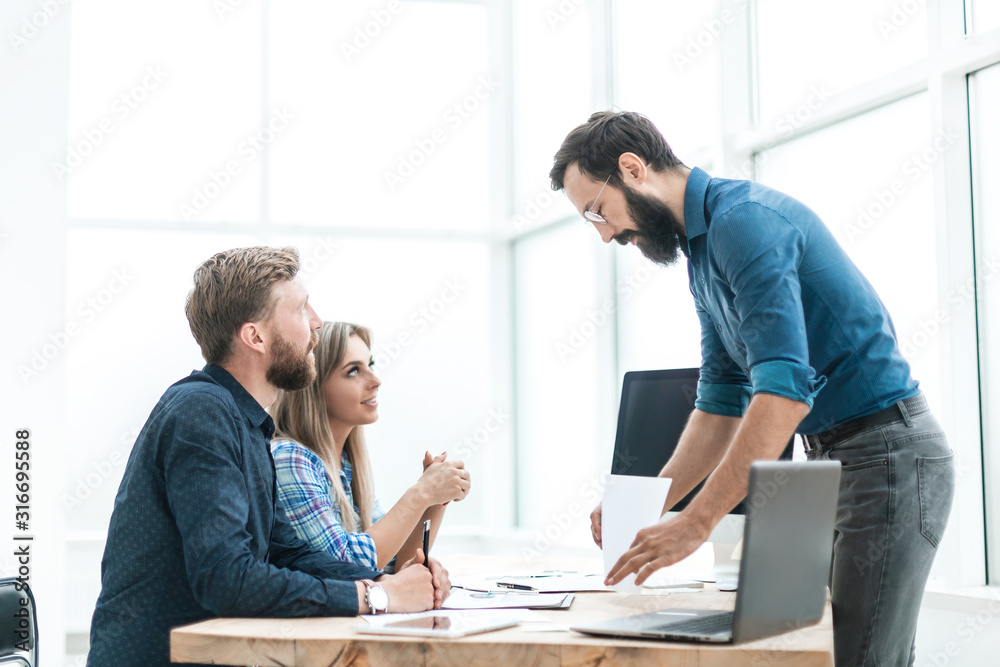 employees discuss something with a visitor to the Agency employees discuss something with a visitor to the Agency