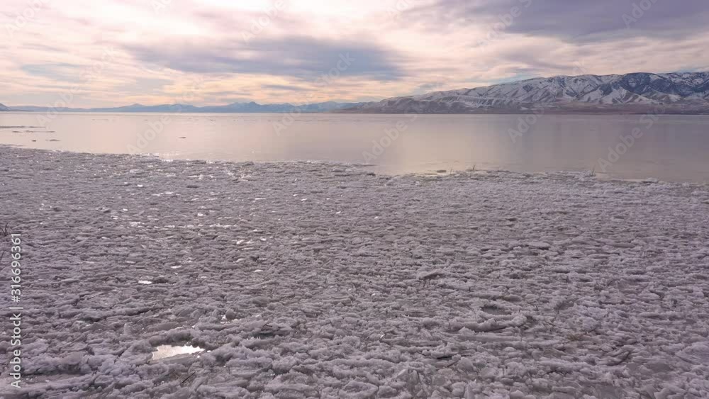 Flying over broken ice on Utah Lake during winter moving over to smooth glassy ice. Flying over broken ice on Utah Lake during winter moving over to smooth glassy ice.