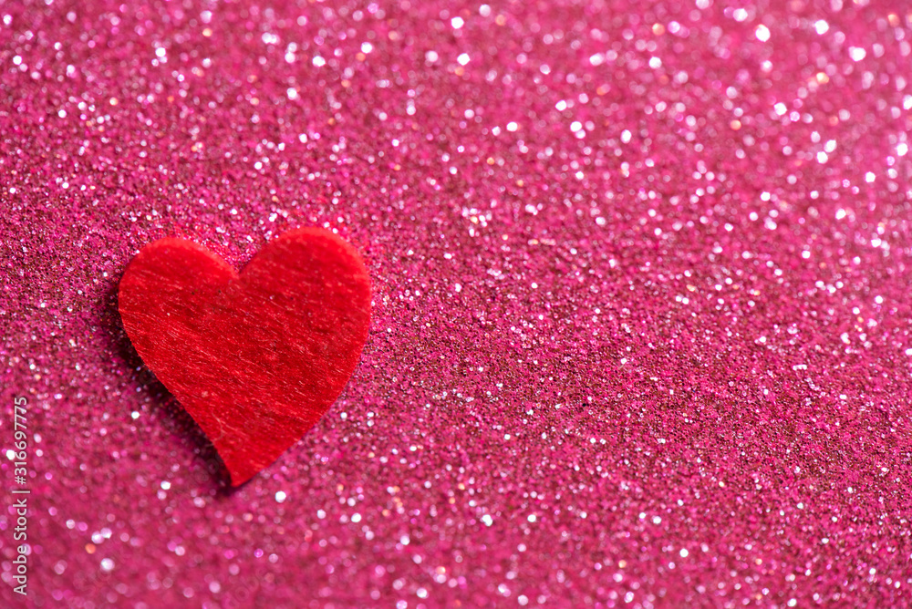 Heart over pink abstract background with bokeh defocused lights
