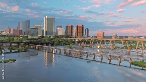 Aerial: Richmond city skyline and James River at sunset, Virginia, USA. 