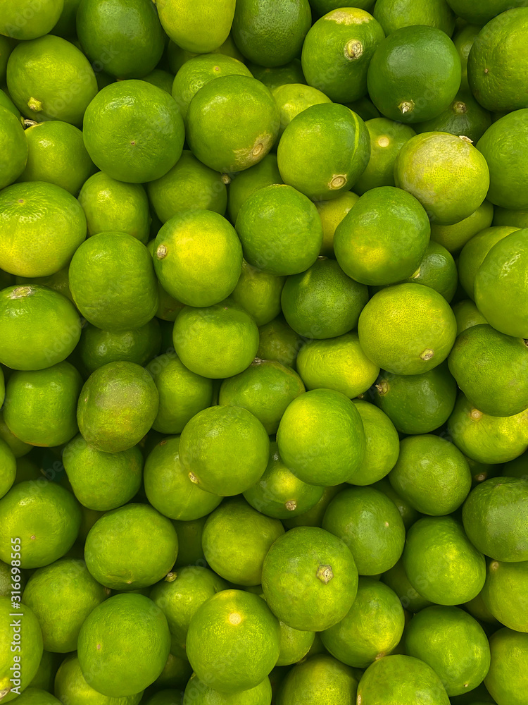 fresh lime close up in market. healthy food texture. vegetables background.