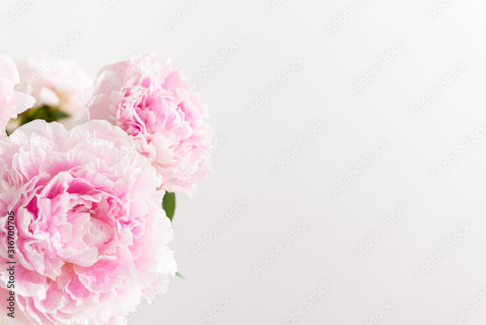 Lovely flowers on a light background. Beautiful bouquet of pink peonies. Floral composition, copy space. Wallpaper, greeting card, poster, floral shop concept Lovely flowers on a light background. Beautiful bouquet of pink peonies. Floral composition, copy space. Wallpaper, greeting card, poster, floral shop concept