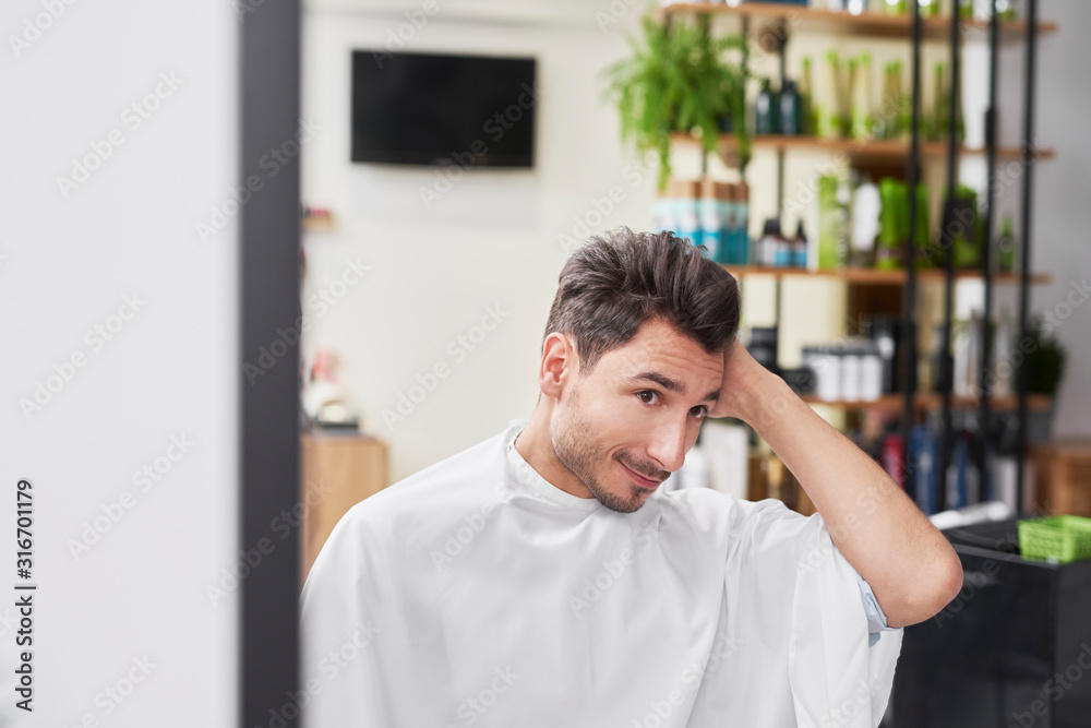 Obraz premium Portrait of handsome man in hair salon