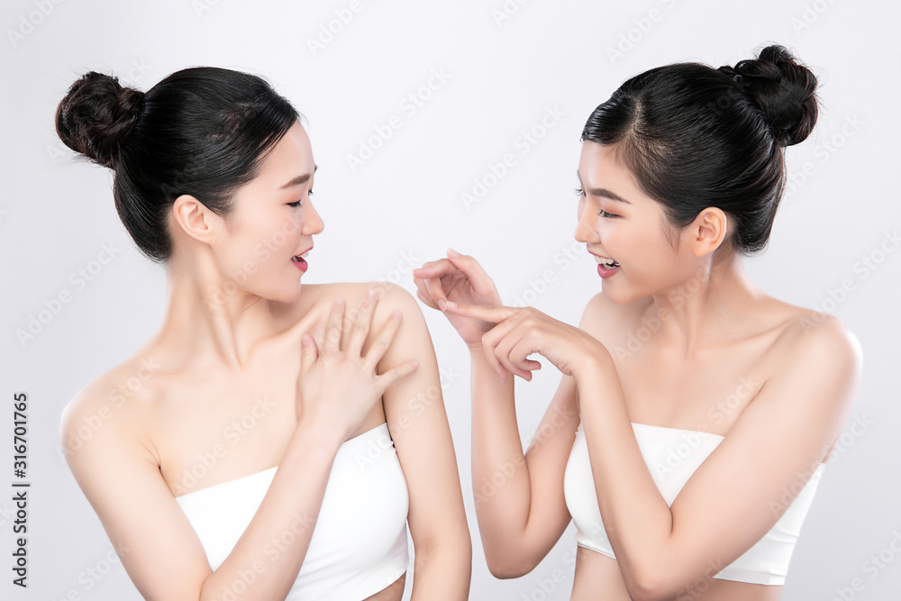Portrait Two beautiful young asian woman clean fresh bare skin concept.  Asian girl beauty face skin care and health wellness, Facial treatment, Perfect skin, Natural make up, on white background