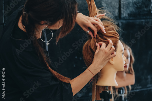 Training hair styling on a mannequin